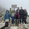 Hikers gathered at Abra Salkantay summit, celebrating their achievement during the 5-day Salkantay Trek with Wander Free Peru.
