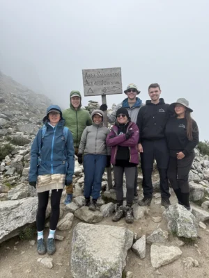 team-at-abra-salkantay-4600m Hikers gathered at Abra Salkantay summit, celebrating their achievement during the 5-day Salkantay Trek with Wander Free Peru.